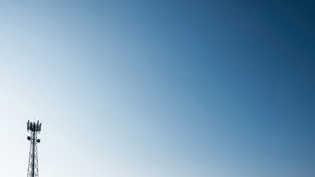 Telecommunication tower against clear blue sky background.の素材