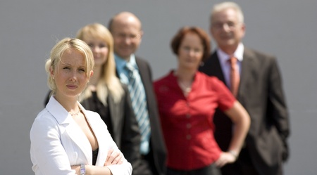 business woman and her team behindの写真素材