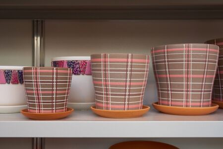 Several ceramic flower pots on the the shelfの写真素材