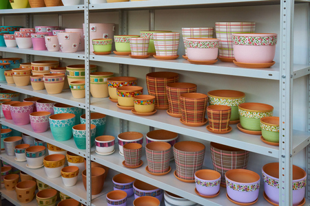 New ceramic flower pots placed on the the shelvesの写真素材