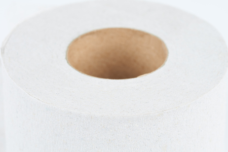 Close-up of the white inexpensive toilet paper rollの写真素材