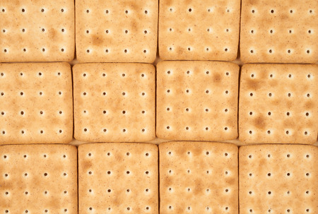 Twelve cookies put on flat wooden surface for food background