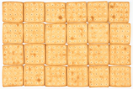 Twenty four cookies put on flat surface for food background