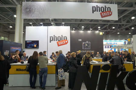 Moscow Crocus Expo, Moscow, Russia - April 15, 2016: Visitors trying Nikon cameras at Nikon Distributor company Photo Sale at Photoforum 2016のeditorial素材