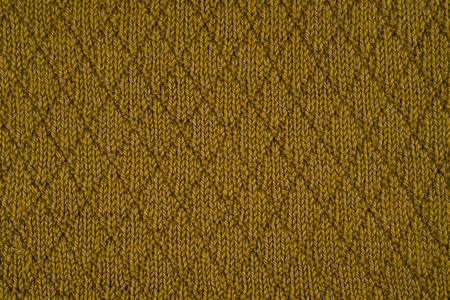 Green knitted yarn as a seamless backgroundの写真素材