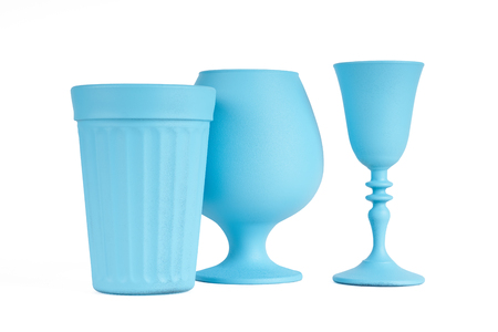 Three pieces of blue painted glassware isolated on whiteの写真素材