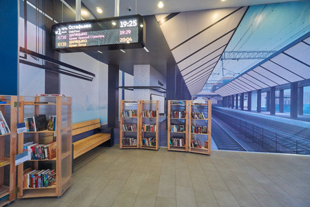 Moscow, Russia - May 16, 2019: Interiors of the exhibition of the Moscow railway system, Moscow Central Diameters. Library for visitors and wall photography of new train station conceptのeditorial素材