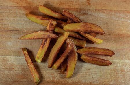 Homemade French Fries on wooden background top view