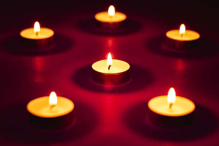 Burning candles on beautiful colorful background, Memory day.の写真素材