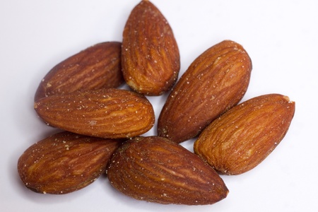 Roasted salted almonds with no shell on a white backgroundの写真素材