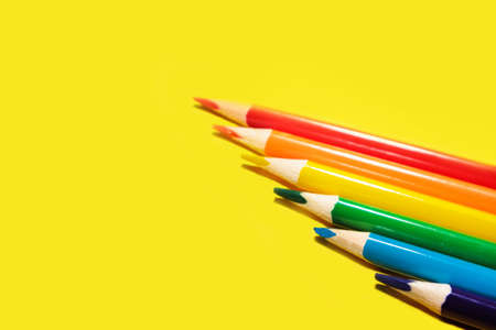 crayons concept closeup of various colors, rainbow color selection, equality or LGBT gay pride flag or beautiful life concept on yellow backgroundの写真素材