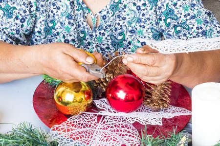 Christmas decorations with candles, pine and ribbons