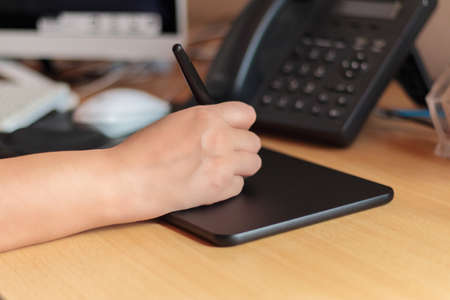 newborn cat drinking milk from the bottleの写真素材