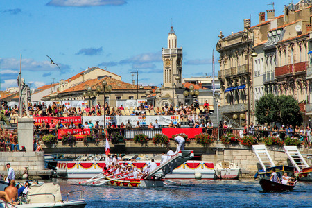 SETE, FRANCE - August 23, 2014: Water Jousting performance during St.Louis festival at the streets of Sete, South of France on August 23, 2014. (Saint Louis is the patronal feast of Seteand also the jousters holiday which offers Six days of non-stop festiのeditorial素材