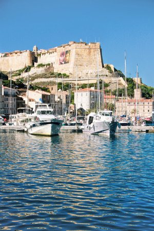BONIFACIO, CORSE, FRANCE - September 14, 2013: Harbor of Bonifacio -  the oldest town in Corsica extends for some distance along the cliff-tops (the cliffs are listed in the UNESCO world heritage)のeditorial素材