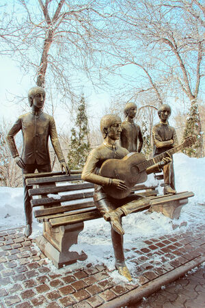 ALMATY, KAZAKHSTAN â MARCH 10, 2014: A bronze bench of Â«The BeatlesÂ»  by sculptor Eduard Kazaryan   inaugurated on Kok Tobe mountain on May 15, 2007 in Almaty, Kazakhstan. This is the first and only monument of the legendary Fab Four in full: John Lenのeditorial素材