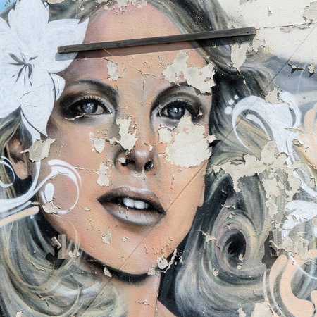 VILLENEUVE LES MAGUELONE, FRANCE - SEPTEMBER 20, 2014: Old graffiti portrait of a beautiful woman at the parking area near Villeneuve-les-Maguelone, Herault, south of Franceの写真素材