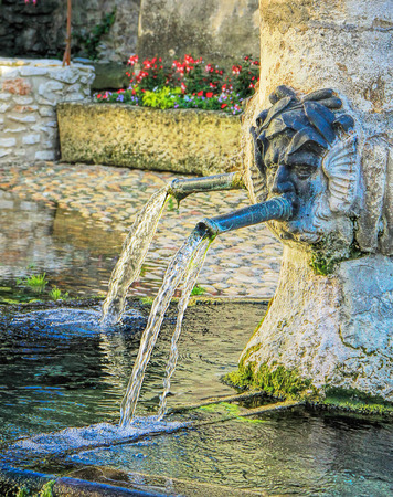 Ancient fountain in  Tavel village in the south of Franceの写真素材