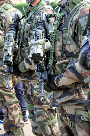 Ready for combat: Close up of  soldiers with  gunsのeditorial素材