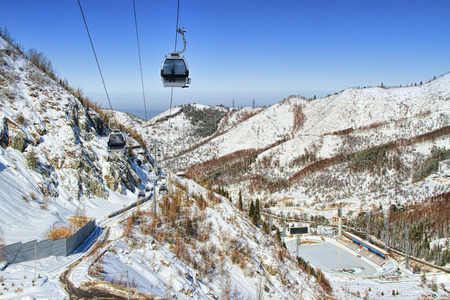 ALMATY, KAZAKHSTAN - FEBRUARY 25, 2014: Ski lifts and  Medeo (or Medeu)  outdoor speed skating and...