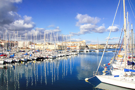 SETE, FRANCE - JANUARY 31, 2015: Boats in the harbor of Sete with colorful reflections of, captured during winter. Sete - fascinating small town on the French Mediterranean coast Known As The Venice of Languedocのeditorial素材
