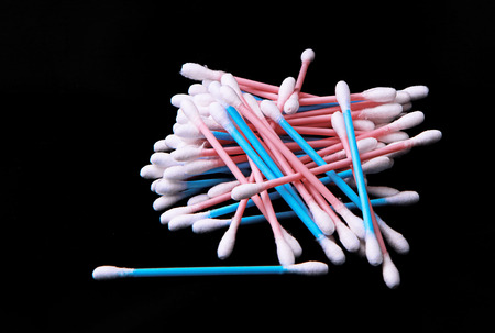 Colorful Cotton swabs over black backgroundの写真素材