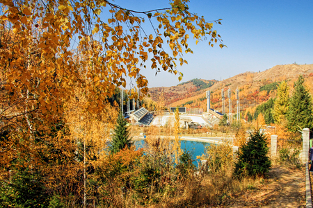 Water reservoir for The Medeo (or Medeu) outdoor speed skating and bandy rink located in a mountain valley on the south-eastern outskirts of Almaty, Kazakhstan. Captured during autumnの素材 [FY31096565675]