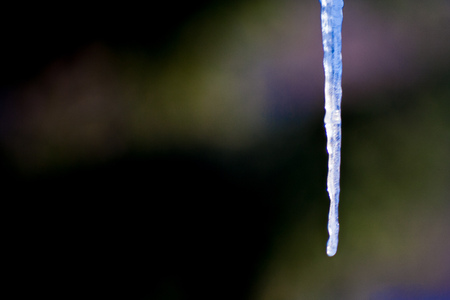 Ice icicle in winter and a unique full-color backgroundの写真素材