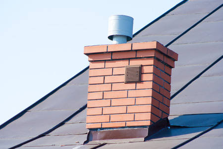 Red chimney and blue backgroundの写真素材