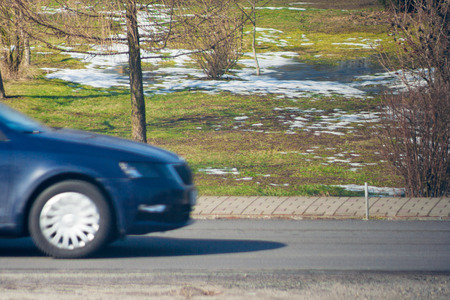 the front of the car moving along the roadの写真素材