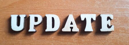 The word 'update' made of wooden letters. wood inscription の写真素材