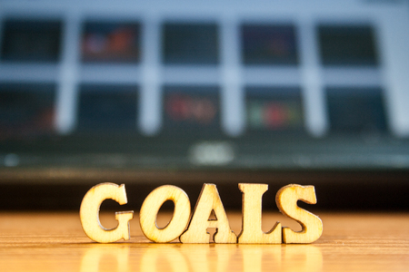 The word 'goals' made of wooden letters. wood inscription on table