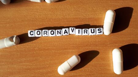 Coronavirus concept letter with tablets and medicine. MERS-Cov middle East respiratory syndrome coronavirus.の写真素材
