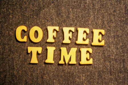 Wooden inscription COFFEE TIME on dark background.の写真素材