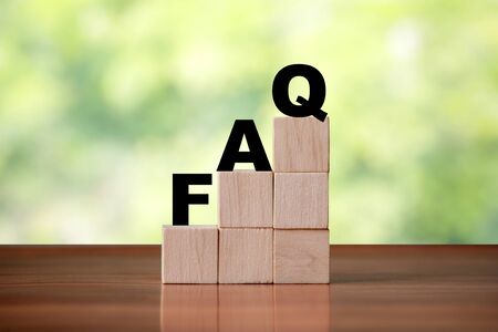 Wooden cube block shapes as step stairs with FAQ . Help concept, frequently asked questionsの写真素材