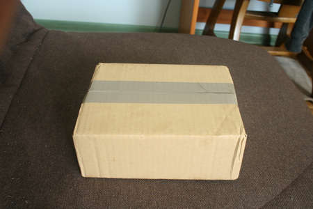 A cardboard package ready to be sent to the recipient.