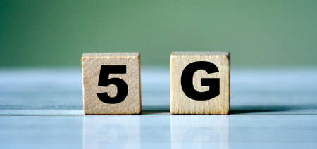 The wooden blocks with the word 5G. High-speed mobile Internet. New generation networks. Big data technology concept.の写真素材