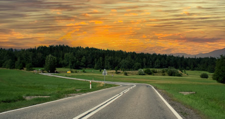 sunset over the road in mountains