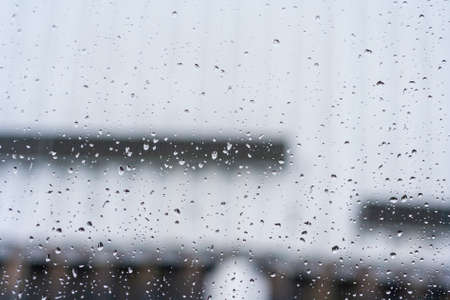 Rain drops on window glasses surface background. Natural Pattern of raindropsの写真素材