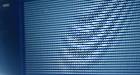 Digital binary code data on computer screen. Hacker concept background.
