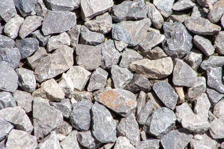 Gravel road stone pattern. Small rock or pebble textured. Top view. Gravel surface background