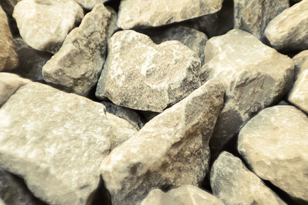 Small gravel road. Pebble background. Crushed stone texture. Gravel rock closeup groundの写真素材