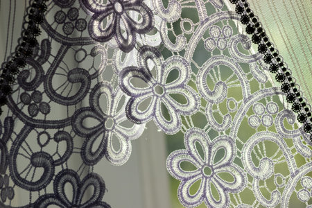 Part of a white frill curtain at home. Interior with a white curtain. Modern curtain closeupの写真素材