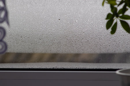 water condensation on window glass. Humidity in the house. home moisture.の写真素材