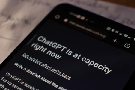 Warsaw Poland - February 24, 2023: ChatGPT is at capacity right now. Popular AI chat. ChatGPT Chat with AI or Artificial Intelligence.のeditorial素材