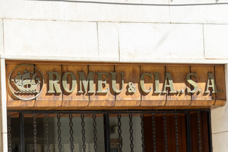 Alicante Spain - July 17 2025: An exterior view of a building showcasing the vintage sign of Romeu & Cia SA a commercial establishment.のeditorial素材