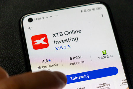 Warsaw Poland - September 24 2025: A smartphone screen displaying the XTB Online Investing app with stats and installation button illustrating modern investment solutions.のeditorial素材