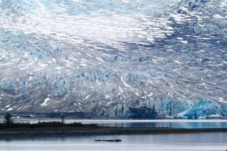 Blue White Glacier at water edgeの写真素材