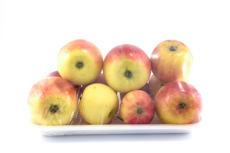Apples in a basket isolated on white
