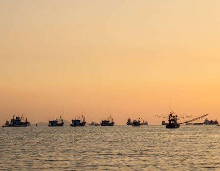 Thai fishing boat used as a vehicle for finding fish in the sea.at sunset